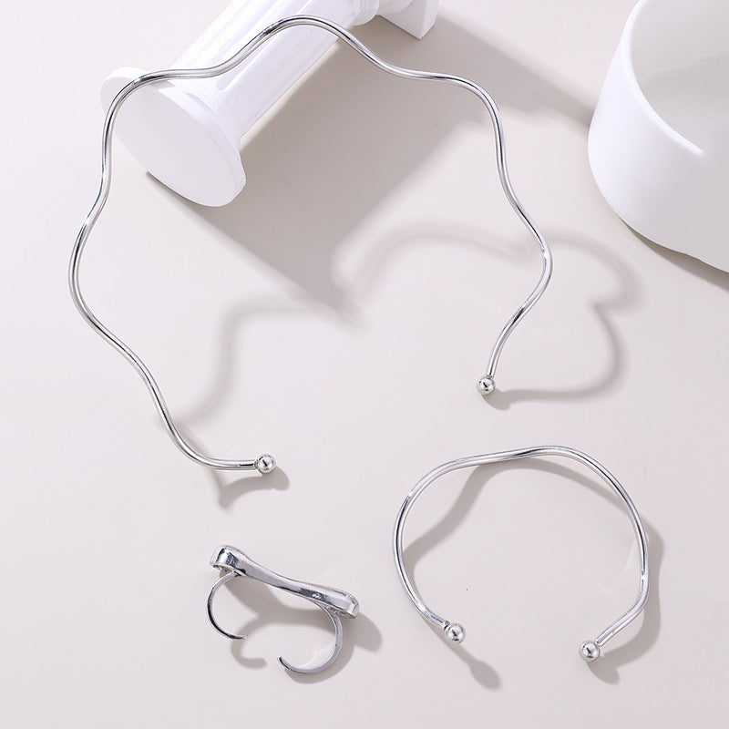 Set geometrico collana, bracciale e anello