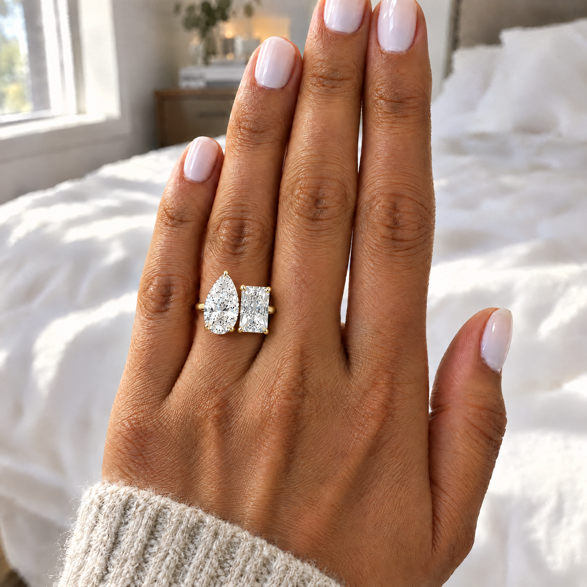 Toi et Moi Pear & Radiant Ring worn on the hand in daylight