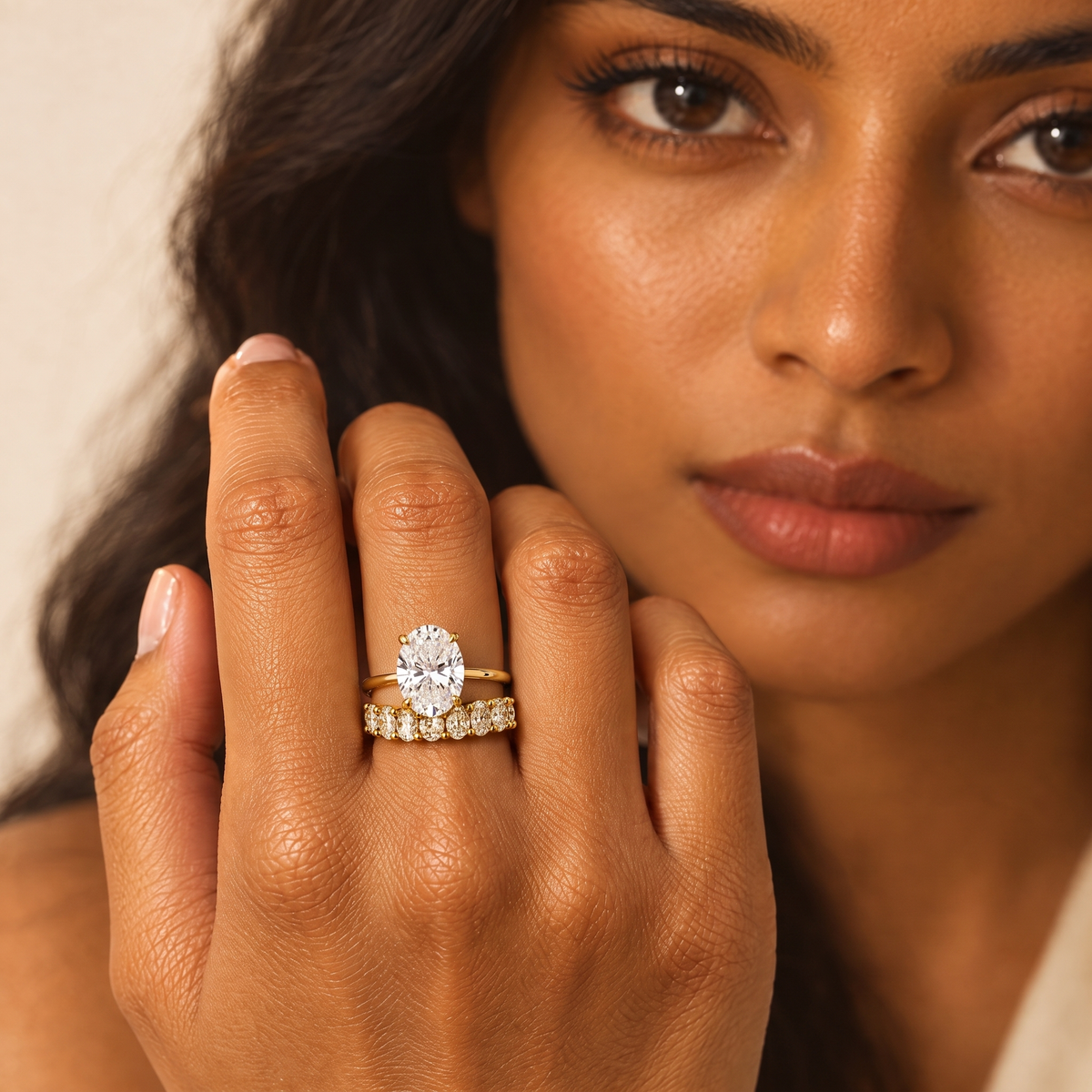 Grand Oval Solitaire Ring stacked with an oval eternity band