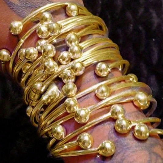 Set di bracciali rigidi con sfere