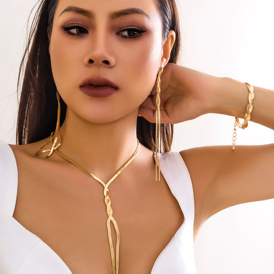 Set 3 pezzi con nappina a V in oro