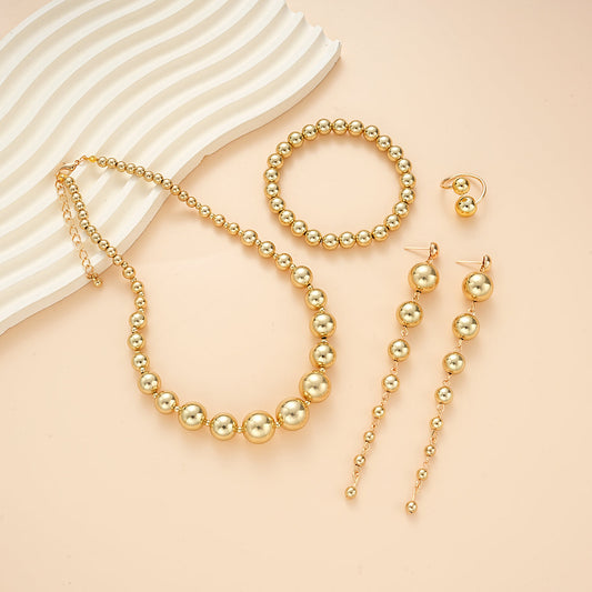 Set di gioielli con perline dorate 4 pezzi