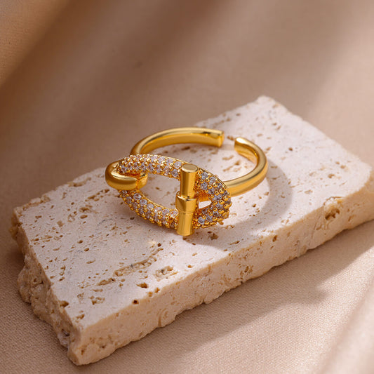 Anello aperto con zircone ovale dorato