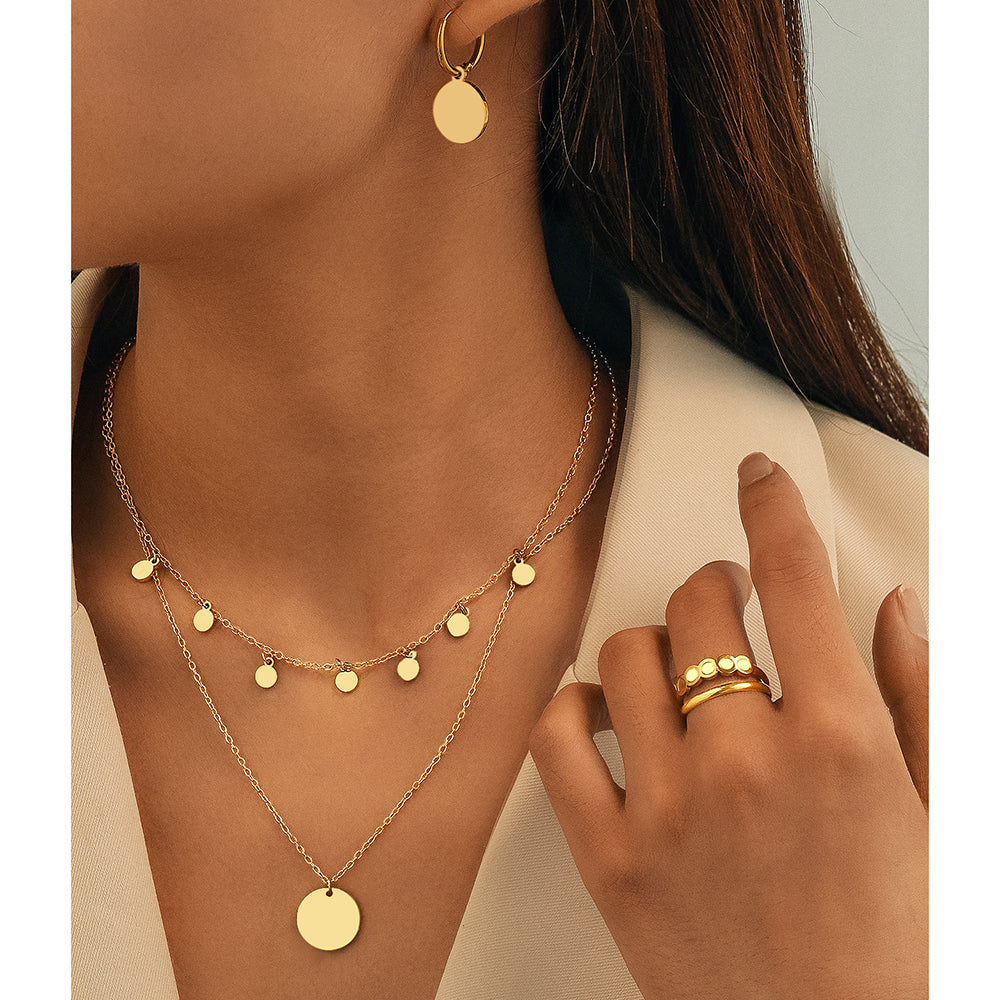 Set di gioielli con ciondoli a disco in oro, 4 pezzi