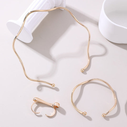 Set geometrico collana, bracciale e anello