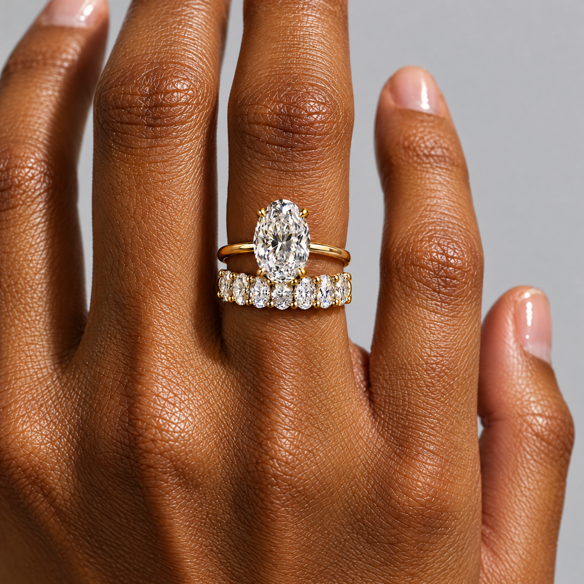 Oval Eternity Band Ring lying on travertine