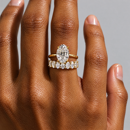 Oval Eternity Band Ring lying on travertine