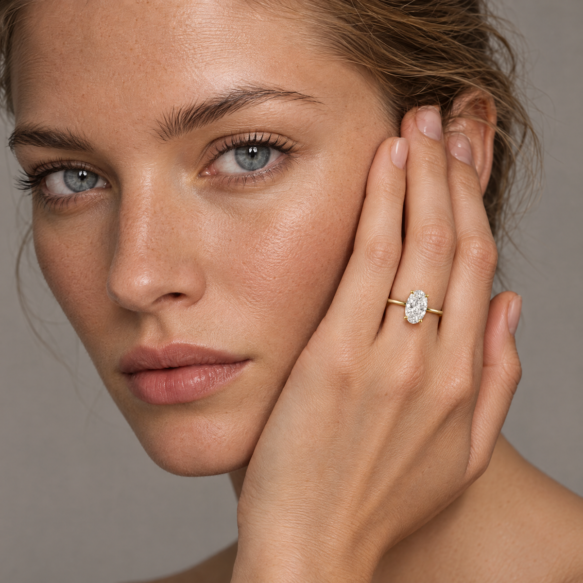 Classic Oval Solitaire Ring stacked with a thin stone-set band