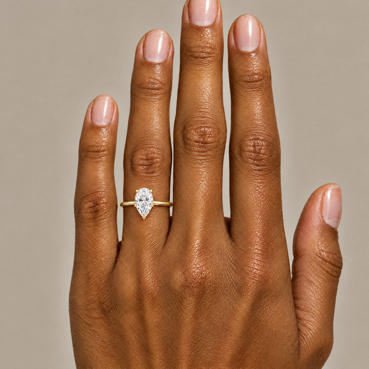 Pear Solitaire Ring worn on the hand