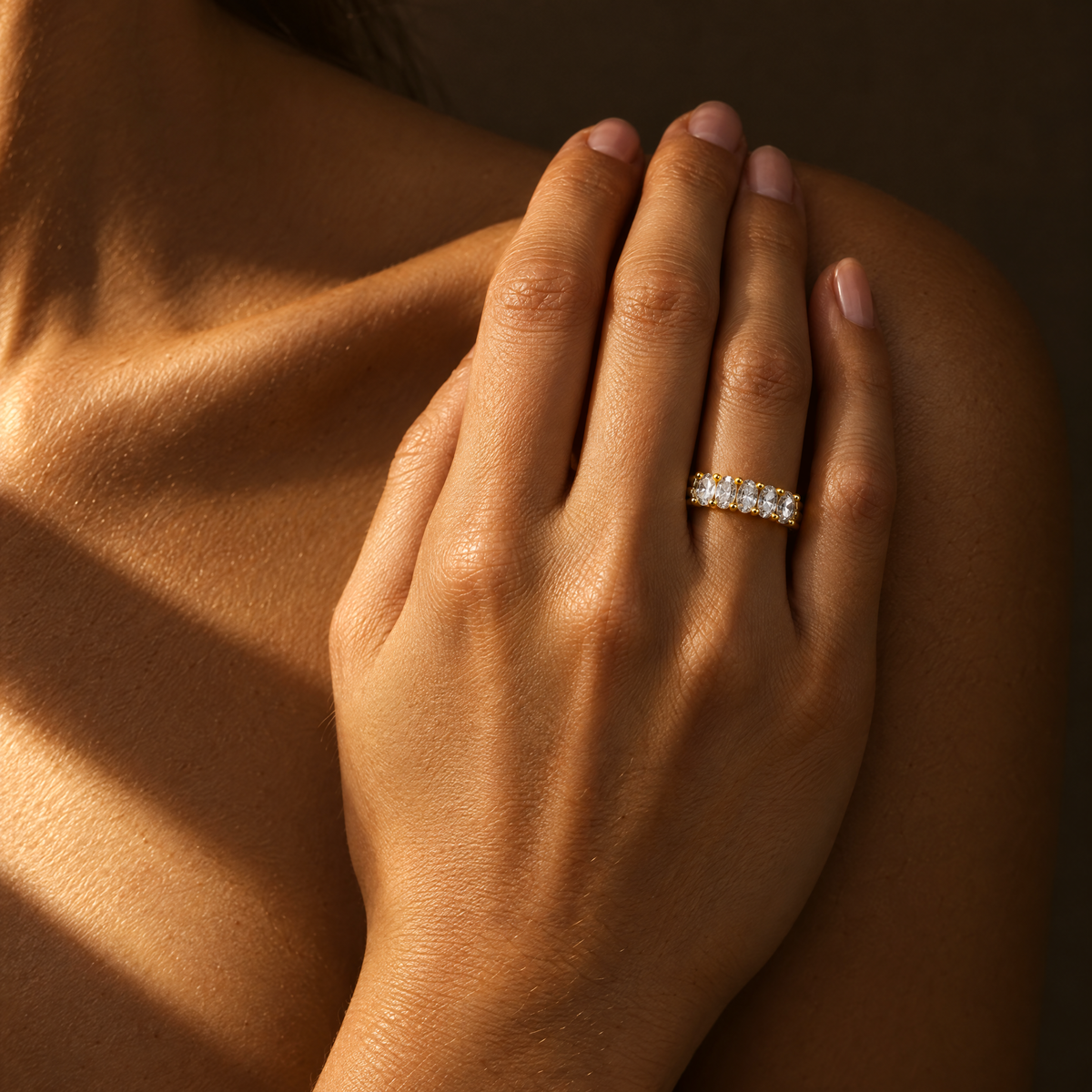 Oval Eternity Band Ring stacked under an oval solitaire