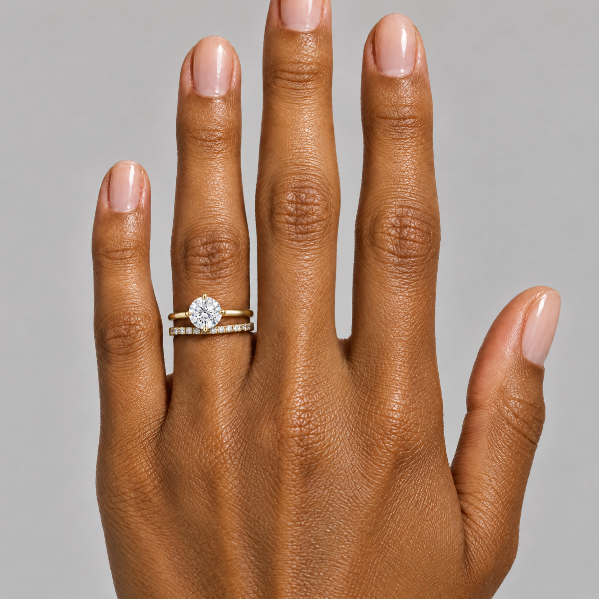 Round Solitaire Ring worn with a neutral outfit