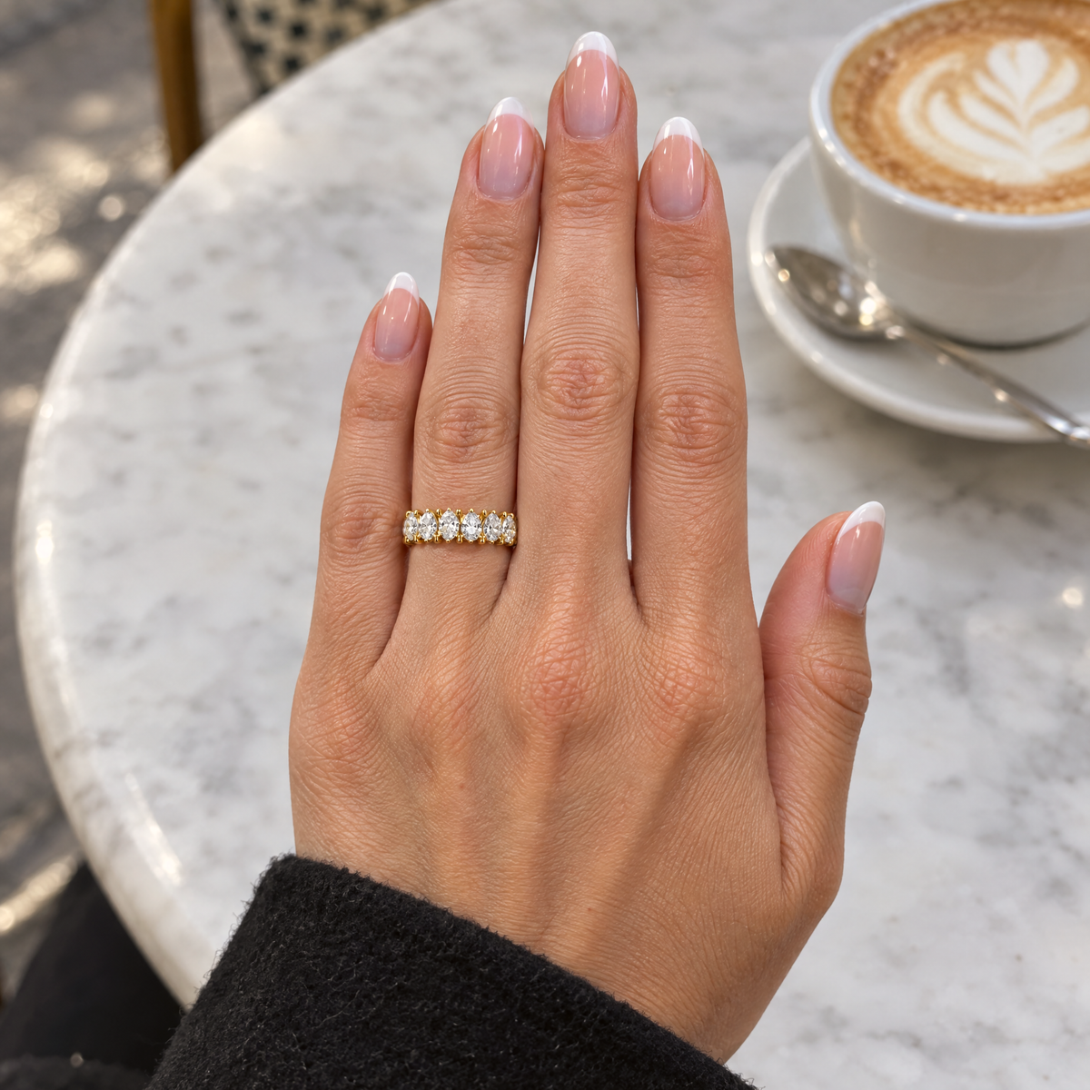 Pear Eternity Band Ring worn with a neutral outfit