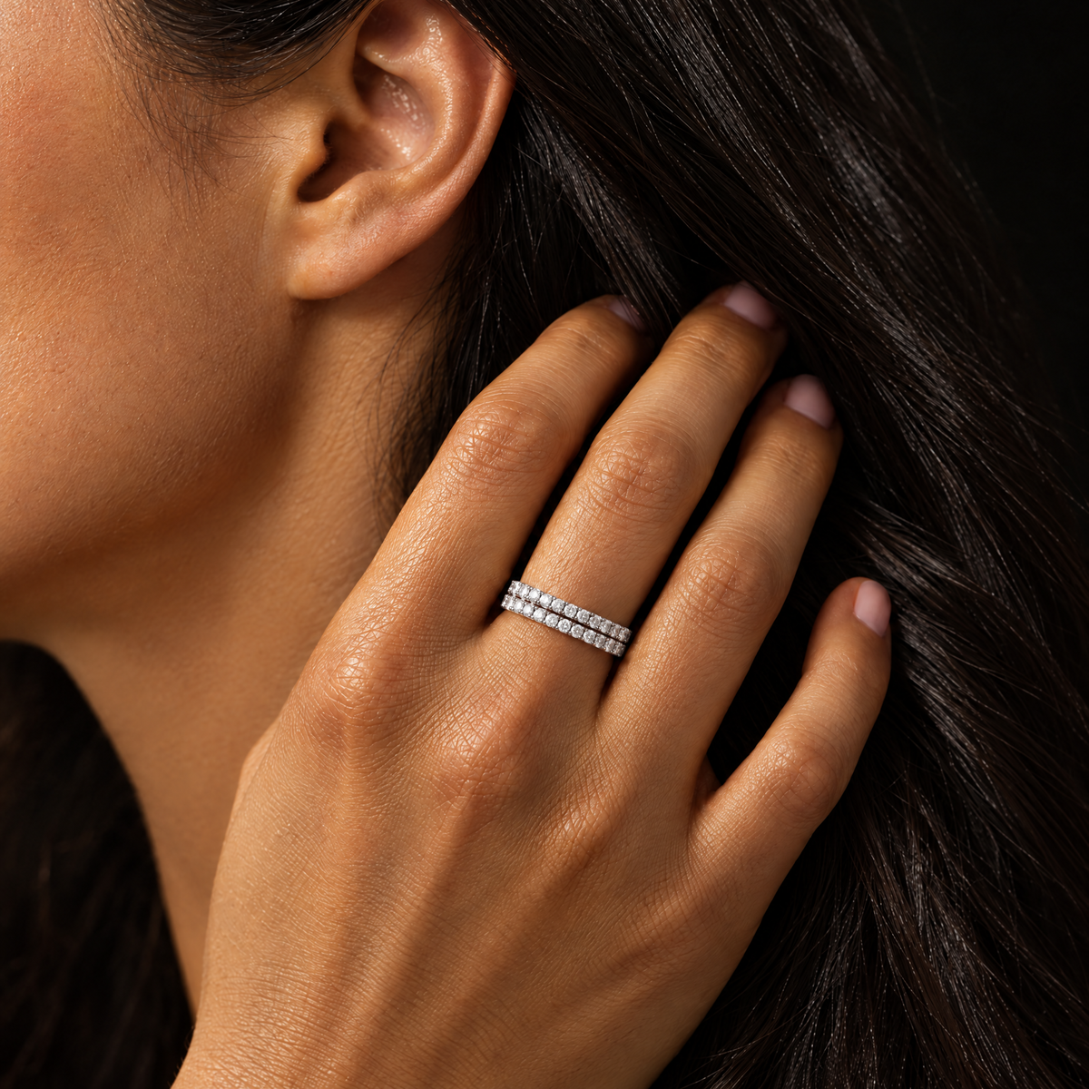 Two silver eternity band rings stacked