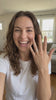 Woman happily showing the Round Solitaire Ring