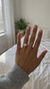 Round Solitaire Ring on the hand, point of view