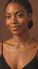Model wearing the Initial Necklace in gold